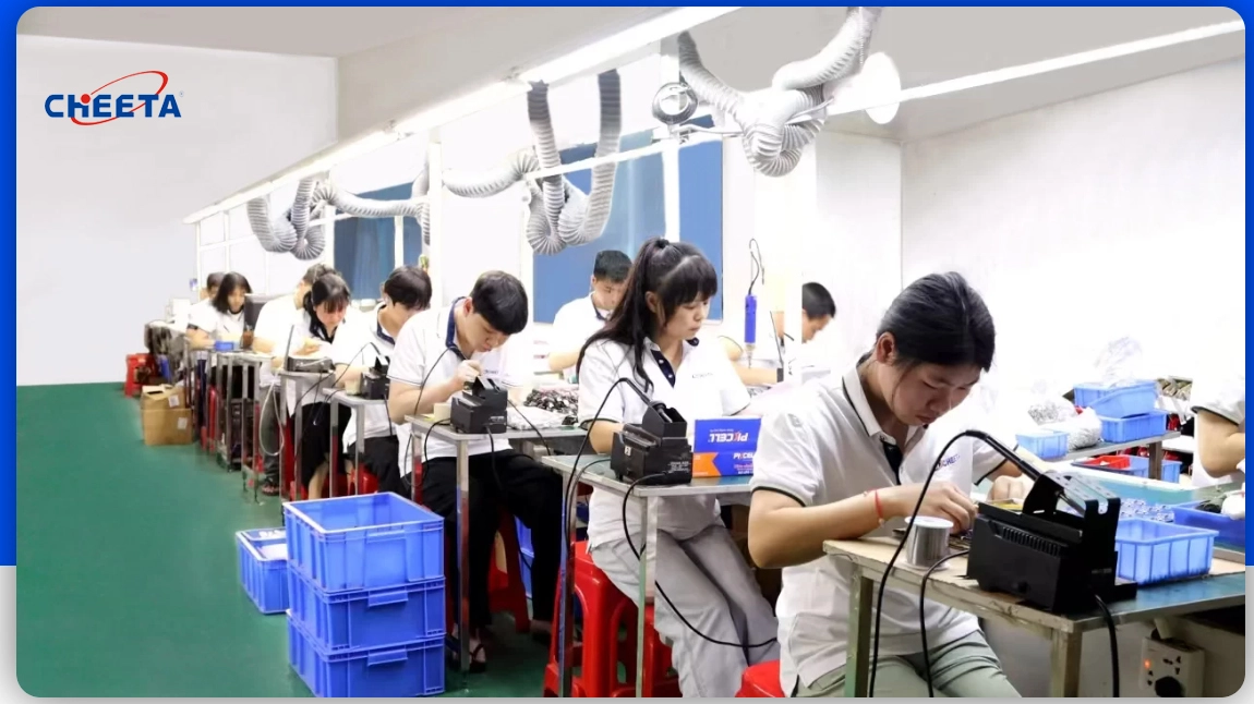 WiFi Video Telephone production line with CHEETA engineers testing and assembling smart terminals.